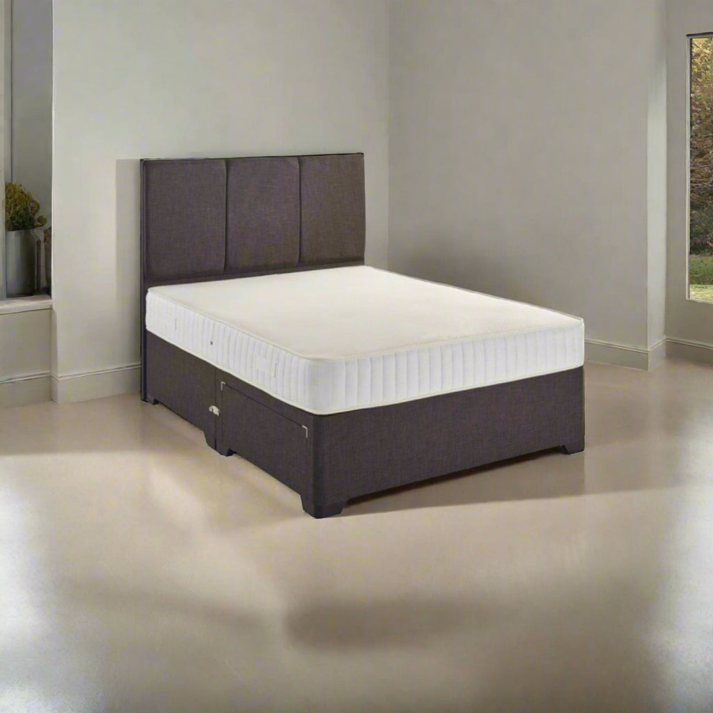 Dreamland Aleena Memory Foam With Spring Mattress - On a bed in a neutral modern bedroom - Beds4Us