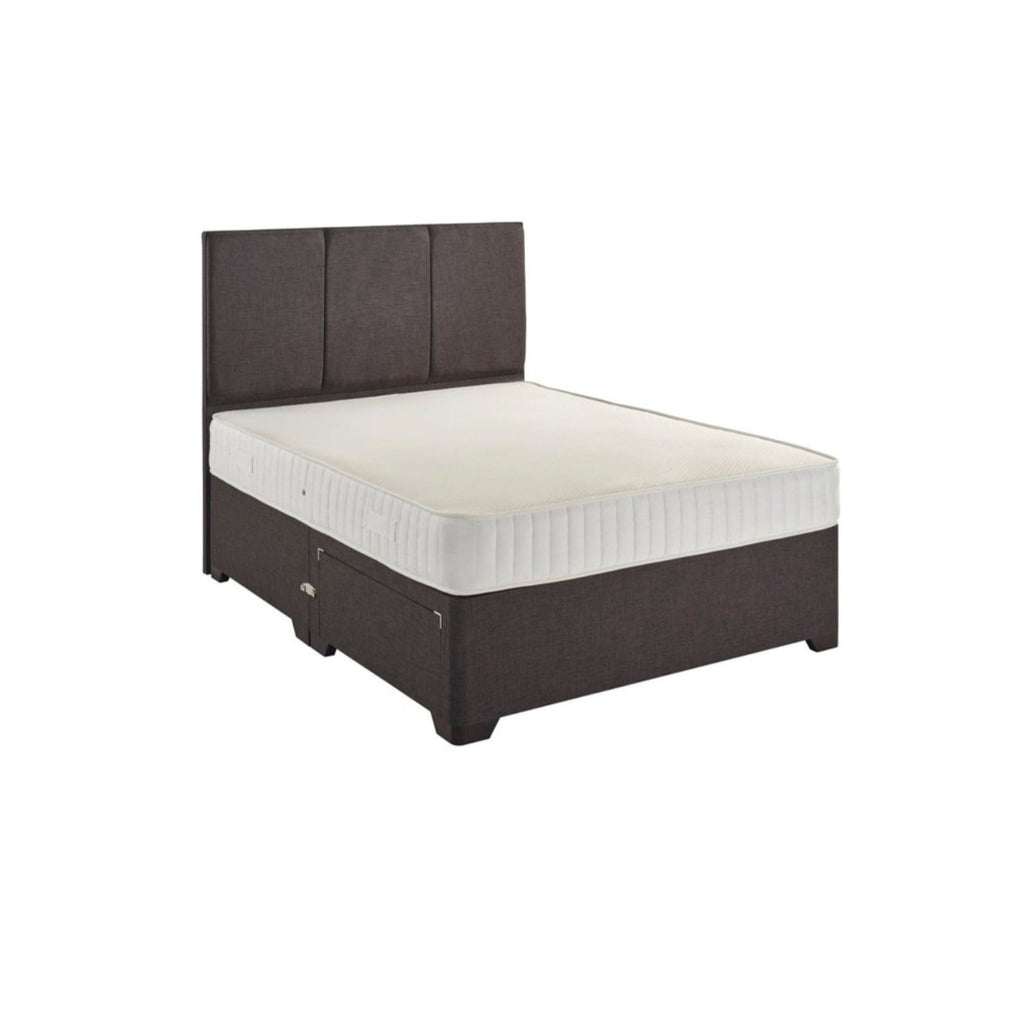 Dreamland Aleena Memory Foam With Spring Mattress - On a bed in front of a white background - Beds4Us