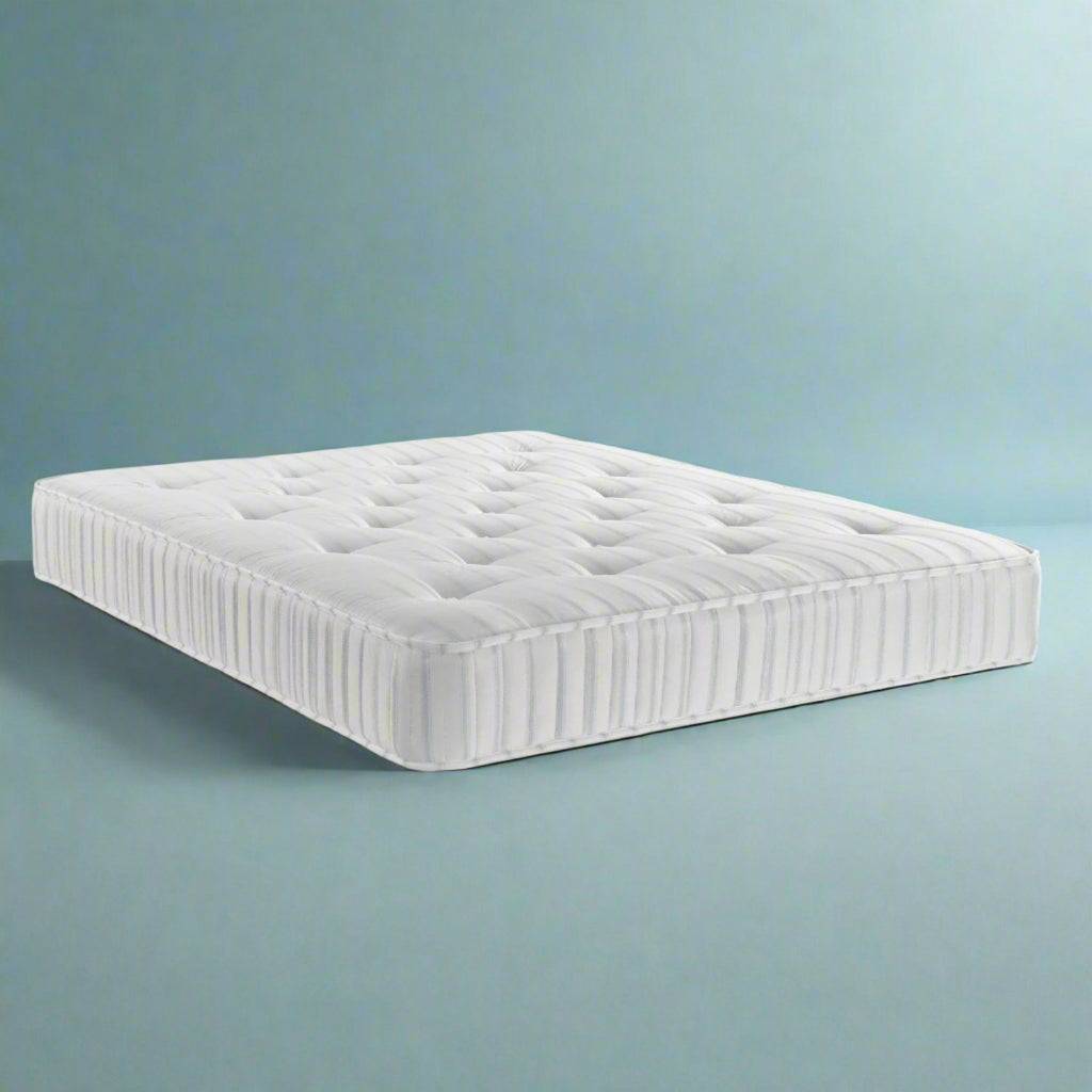 Dreamland Delhia Tufted Mattress - On a blue background - Beds4Us