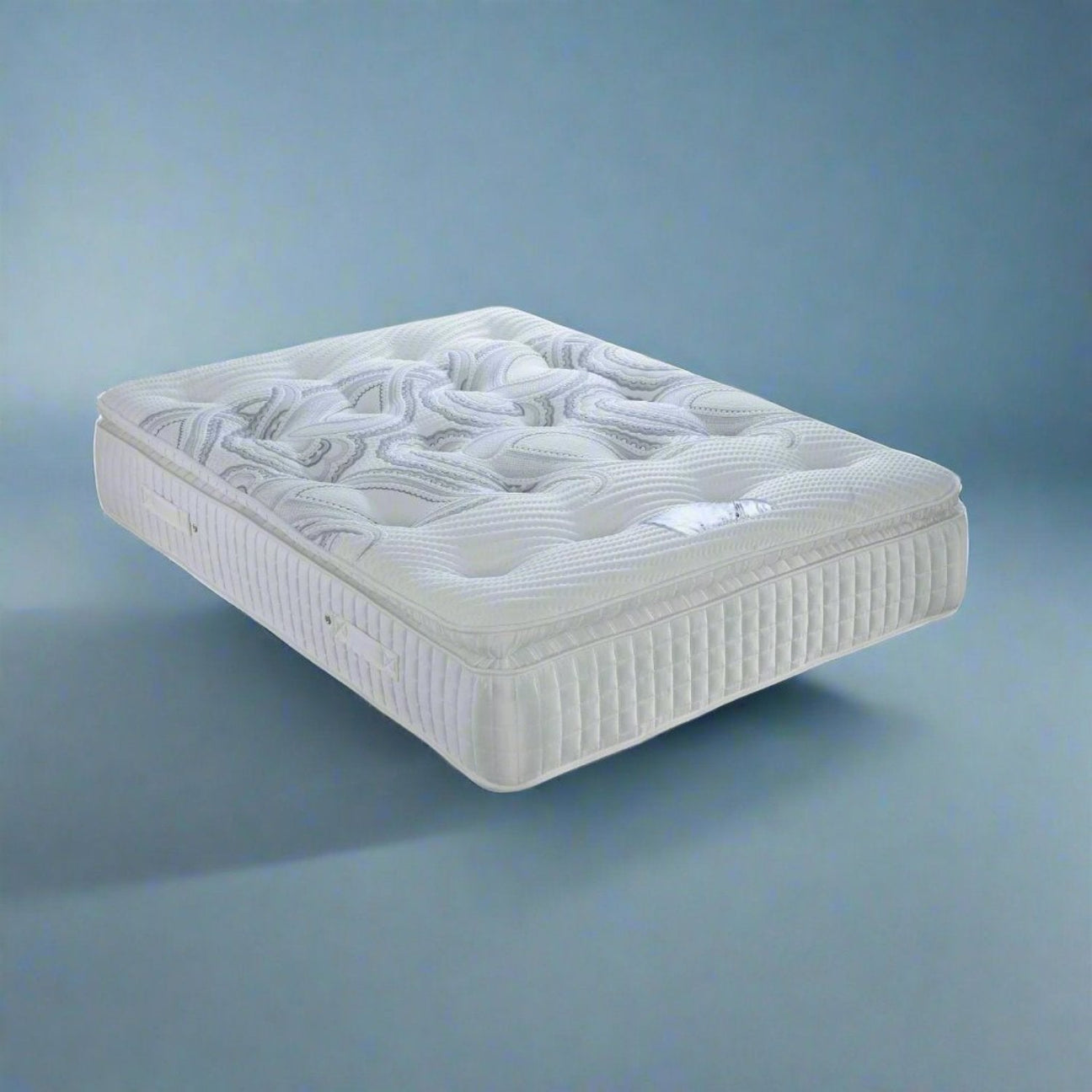 Dura Beds Sicily 2000 Foam Pillow Top Cosy Mattress - Mattress on a blue background, positioned at an angle - Beds4Us