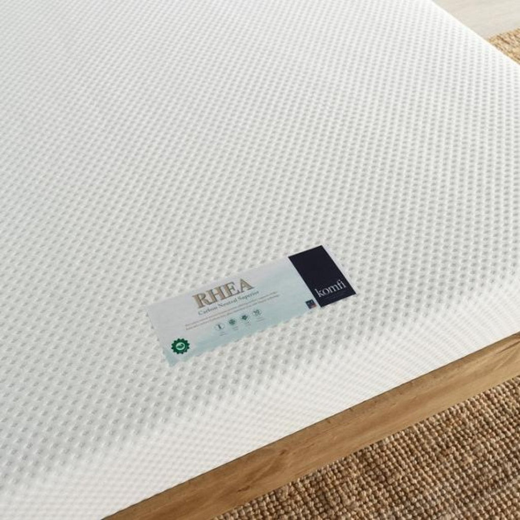 Komfi Rhea Carbon Neutral Superior Eco Mattress - Mattress on a wooden bed frame close up of label - Beds4us