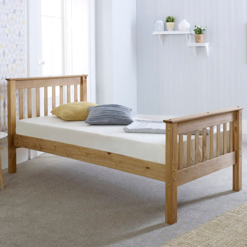 Somerset Solid Pine Wooden Bed- Waxed pine single wooden bed frame positioned at an angle in a light bedroom - Beds4Us