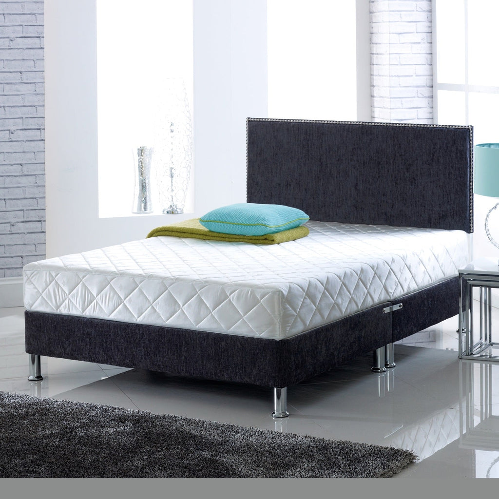 Visco Therapy Deluxe Memory Foam with Spring Mattress - On a bed in a grey room - Beds4us