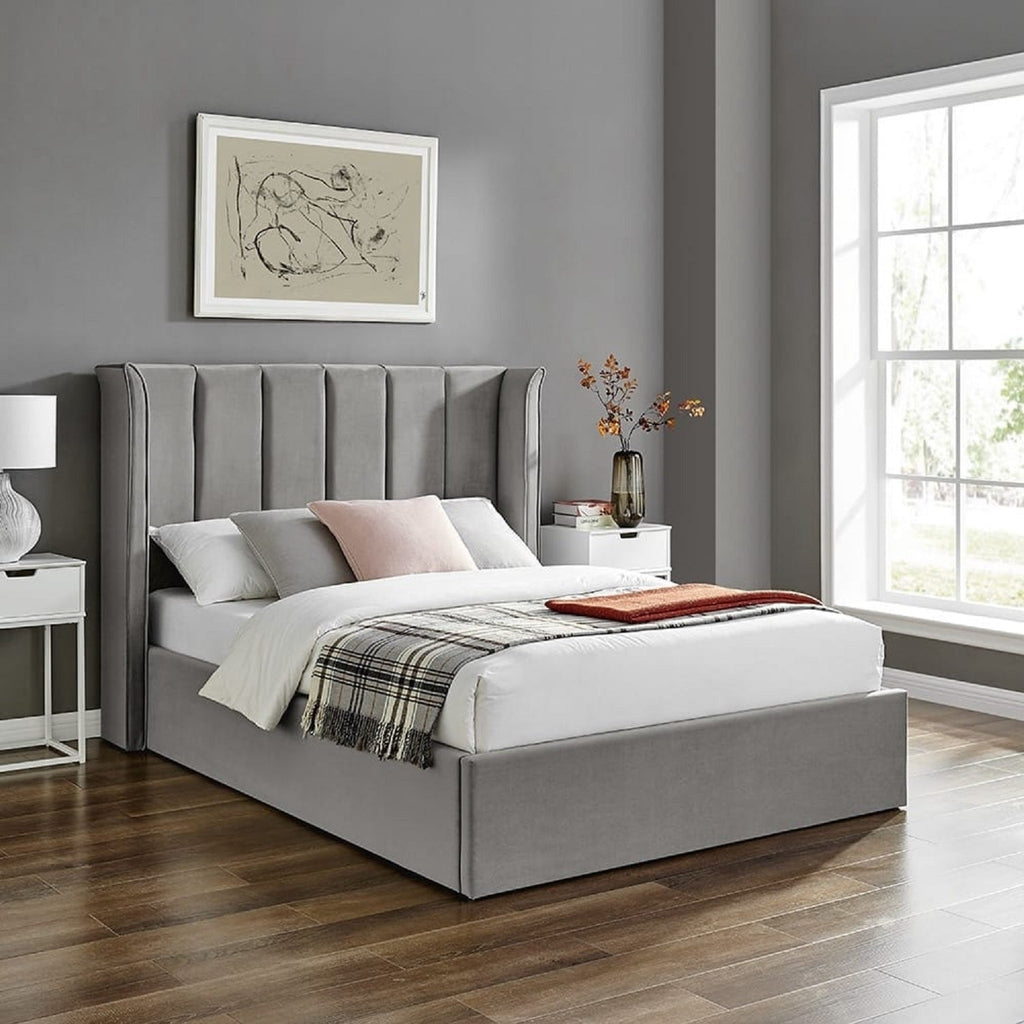 Allegra Velvet Curved Winged Headboard Ottoman Bed - Silver ottoman bed in a grey bedroom - Beds4Us