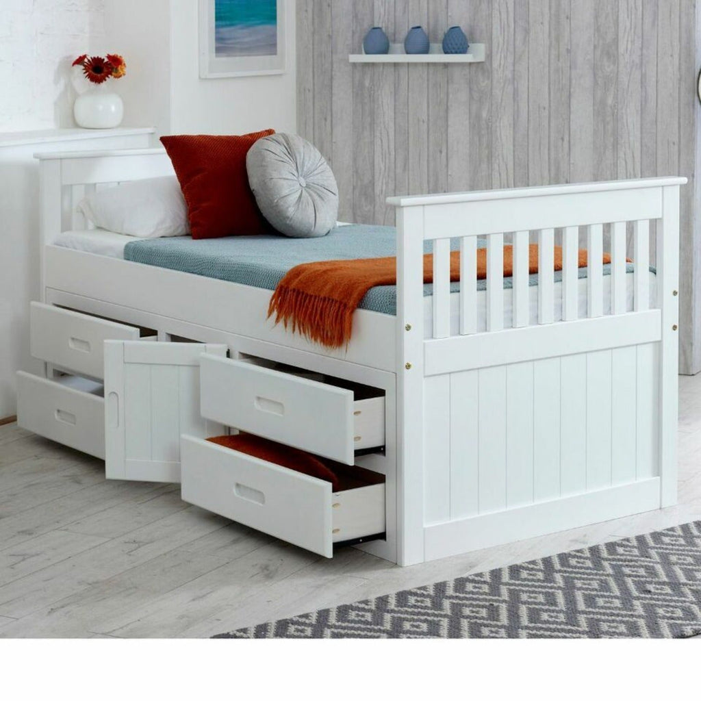 Captains Wooden Underbed Storage Bed - Captain's bed in white, doors and drawers slightly open, positioned at an angle in a grey bedroom - Beds4Us