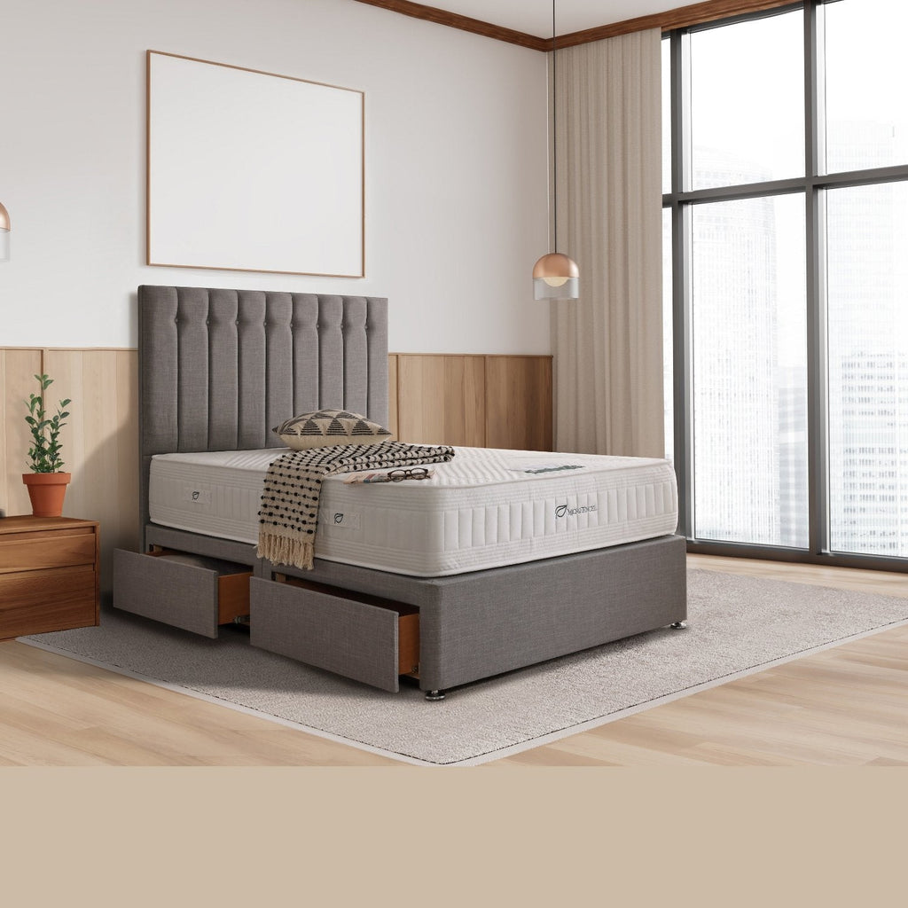Dura Beds Microtencel 1000 Natural Latex Mattress - Mattress in a bright modern bedroom on a divan bed, belongings on top - Beds4Us