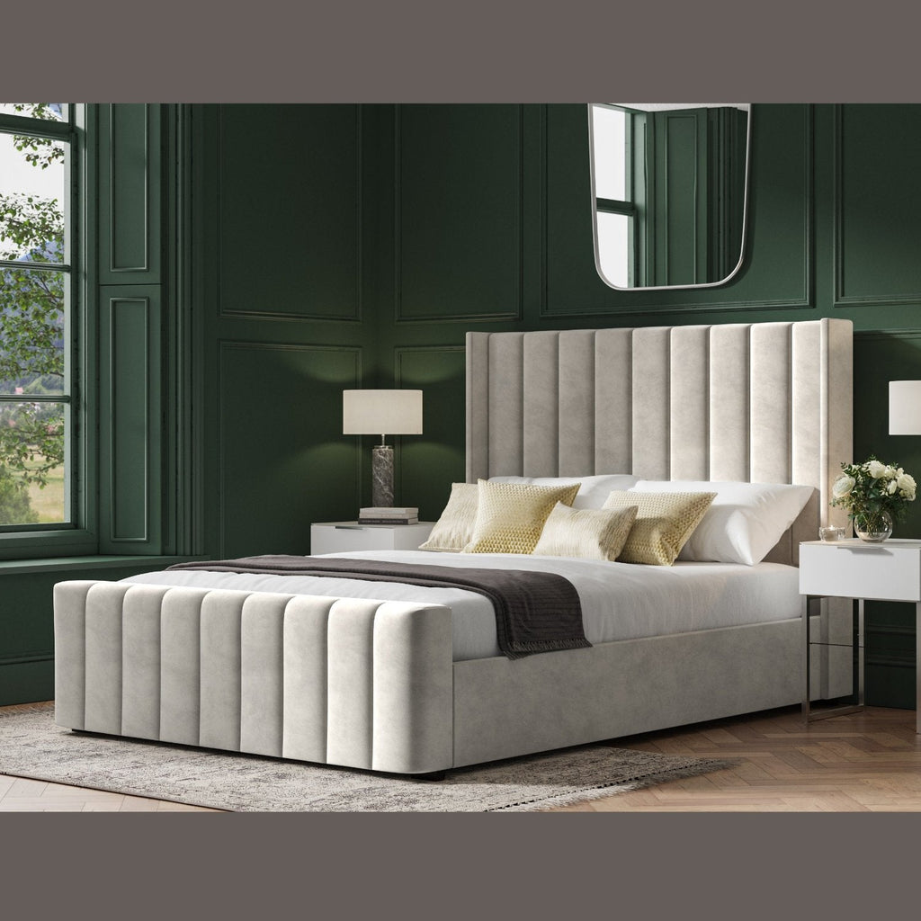 Kilworth Winged Fabric Ottoman Storage  Bed  - Light grey ottoman bed frame positioned at an angle, in a dark modern room - Beds4Us