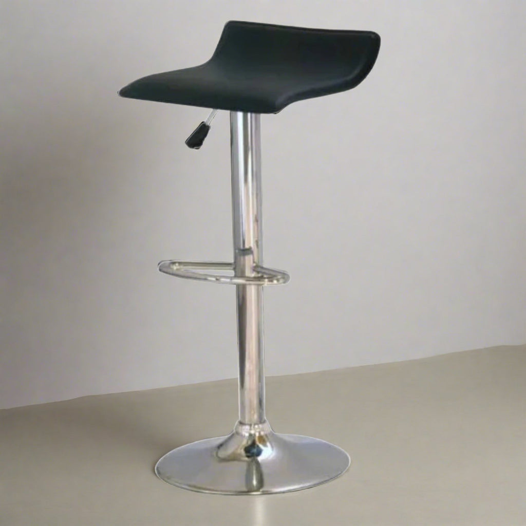 Faux Leather and Chrome Stool - Black faux leather seat with a chrome base and shaft, in a plan grey and beige room - Beds4Us