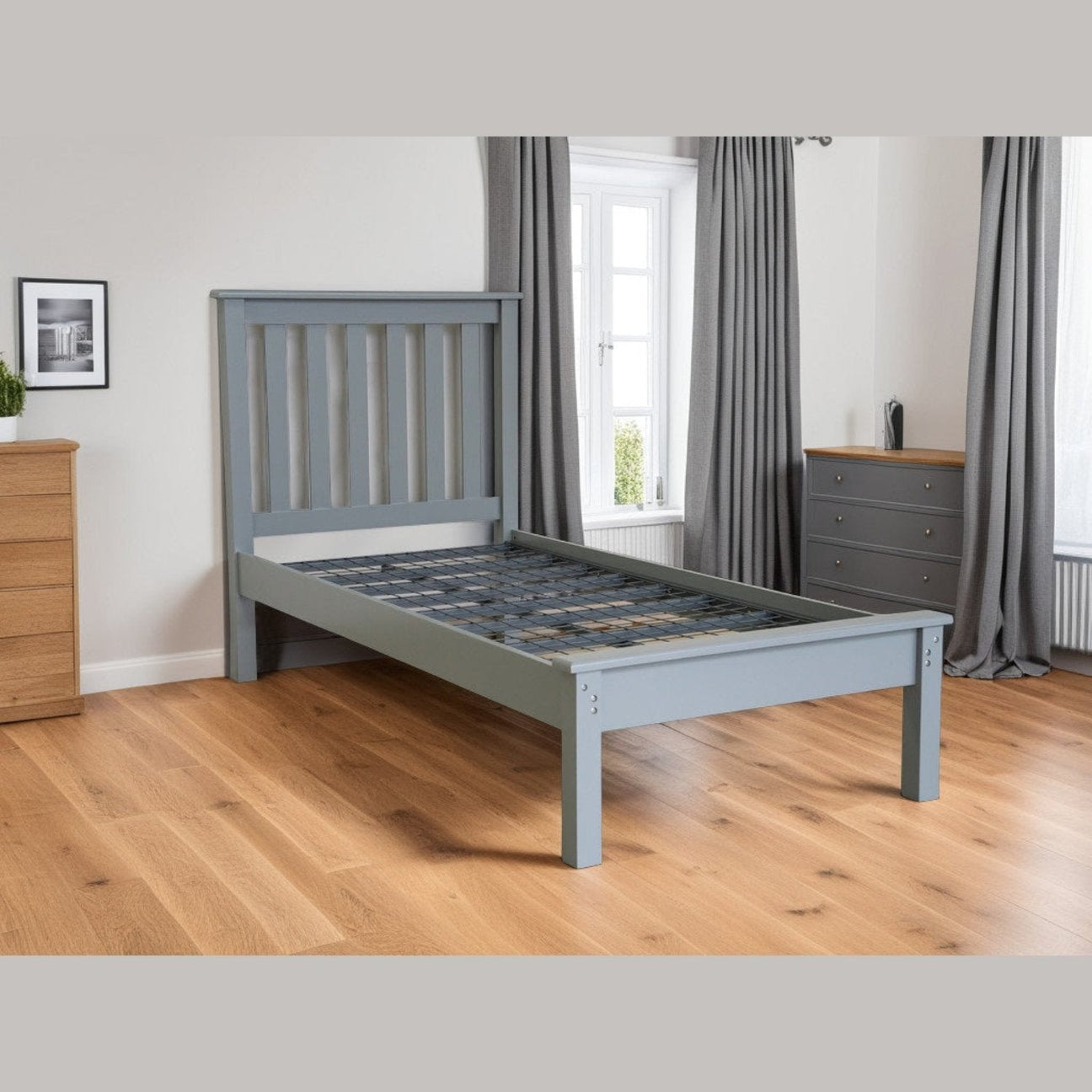 Kiwi Solid Wooden Bed - Grey wooden bed frame with metal mesh base, positioned at an angle, in a modern bedroom - Beds4Us