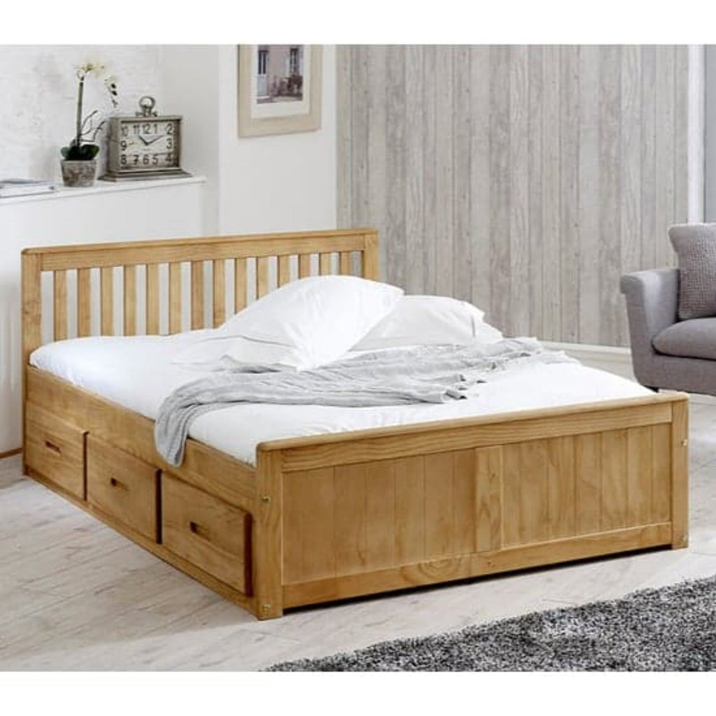 Mission Wooden Storage Bed - Waxed pine, 4'6 double mission bed at an angle, in a grey bedroom- Beds4Us