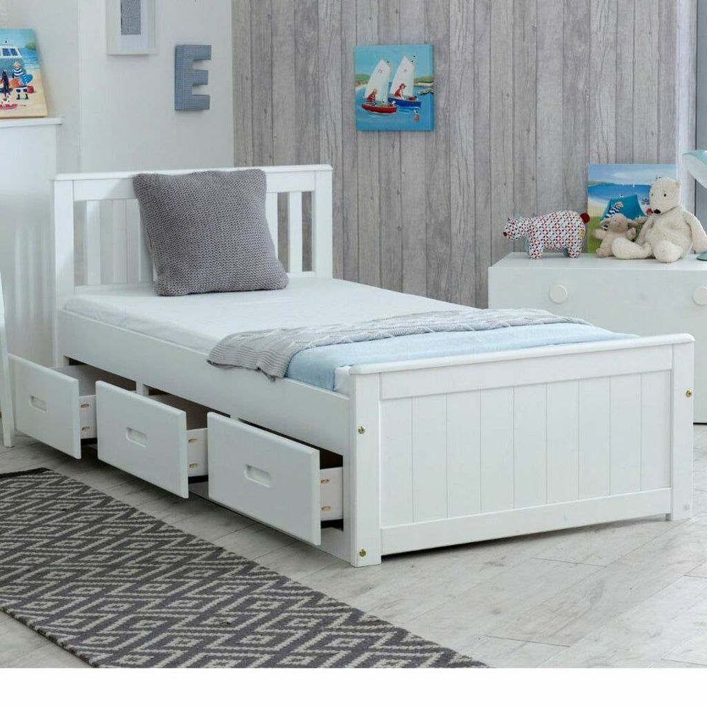 Mission Wooden Storage Bed - White, 3' single mission bed at an angle with the 3 drawers half open, in a grey bedroom- Beds4Us