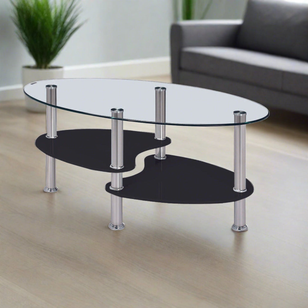 Oval Glass Coffee Table - Clear glass coffe table with split level black glass shelves and chrome legs, in a modern living room - Beds4Us