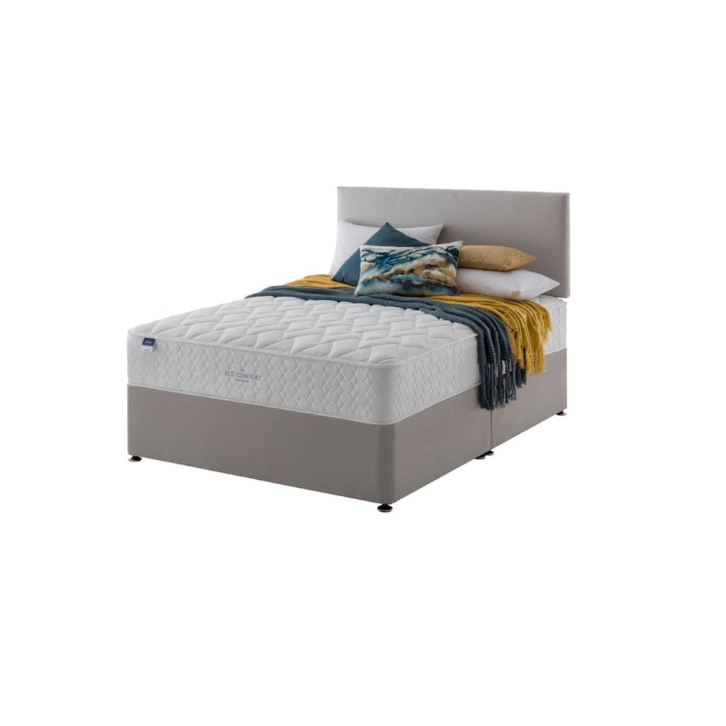 Silentnight Aide Miracoil Eco Comfort Mattress - Mattress on a bed on a white background positioned at an angle - Beds4us