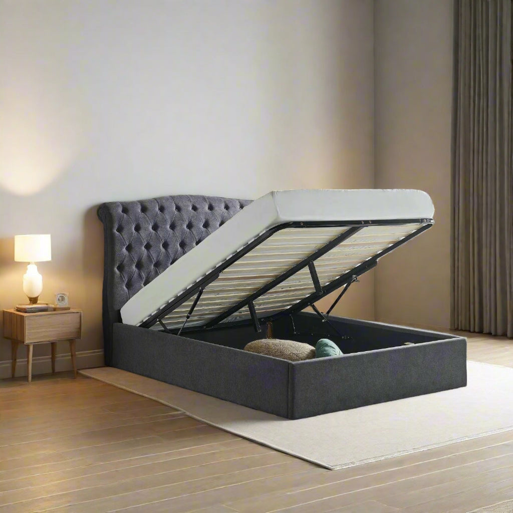 Victoria Plush Chesterfield Ottoman Bed - Dark grey ottoman in a neutral room setting - Beds4Us